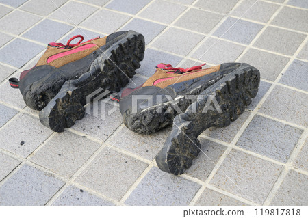 Hiking shoes with torn soles 119817818