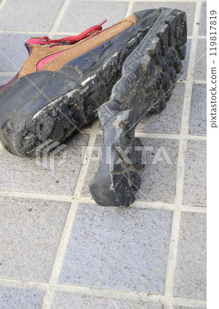 Hiking shoes with torn soles Hiking shoes with torn soles 119817819