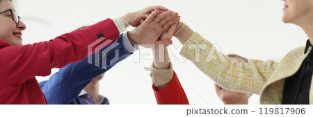 Happy businesspeople join hands during teambuilding training 119817906