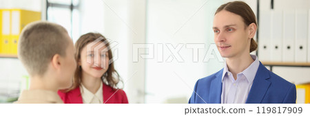 Young employee shakes hand of manager celebrating onboarding Young employee shakes hand of manager celebrating onboarding 119817909