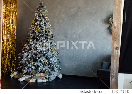 Christmas Tree with Gifts and Toys Decorated Interior for New Year Christmas Tree with Gifts and Toys Decorated Interior for New Year 119817918
