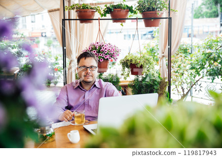 Man Business Study With Internet Laptop In Restaurant Man Business Study With Internet Laptop In Restaurant 119817943