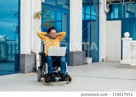 Man In Wheelchair Working Online Learning On Laptop 119817951