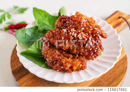 Chicken sticks with sweet and spicy soy sauce Chicken sticks with sweet and spicy soy sauce 119817982