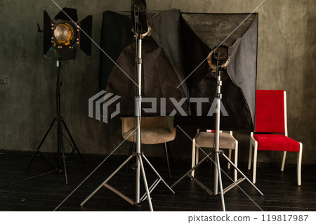 Lighting fixtures and flashes in the interior of the photo studio equipment 119817987