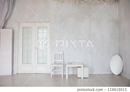 mirror chair and table in the interior of an empty white room 119818015