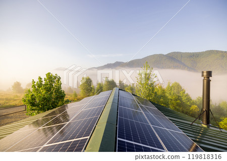 Solar Panels Overlooking a Misty Mountain Landscape 119818316