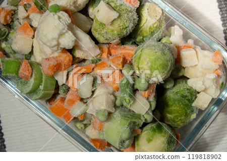 Frozen mixed vegetables for long-term storage. Deep freezing of vegetables. defrosting Frozen food background Frozen mixed vegetables for long-term storage. Deep freezing of vegetables. defrosting Frozen food background 119818902
