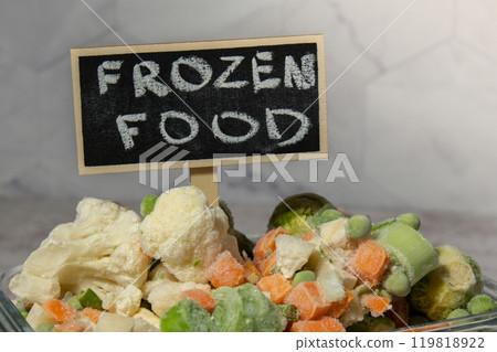 Frozen mixed vegetables for long-term storage with blackboard label and text FROZEN FOOD. Deep freezing of vegetables. defrosting Frozen food background Frozen mixed vegetables for long-term storage with blackboard label and text FROZEN FOOD. Deep freezing of vegetables. defrosting Frozen food background 119818922
