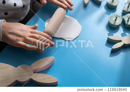 Creator is using white air dry clay for making decor to EASTER holiday. Creating hobby recreation activity that involves fingers. DIY crafting Creator is using white air dry clay for making decor to EASTER holiday. Creating hobby recreation activity that involves fingers. DIY crafting 119819040