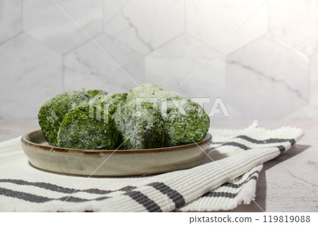 Frozen food spinach cubes homemade. Harvesting concept. Stocking up vegetables for winter storage Frozen food spinach cubes homemade. Harvesting concept. Stocking up vegetables for winter storage 119819088