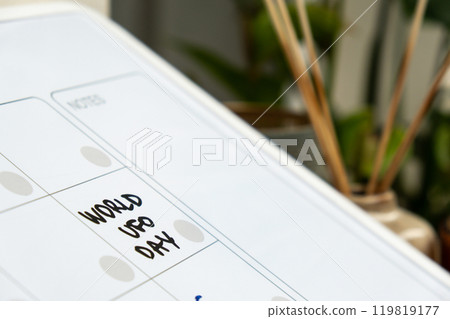 WORLD UFO DAY on calendar to remind important event appointment Monthly PLANNER. Magnetic board with the days of the month. Place to enter important matters schedule. Concept for business planning 119819177