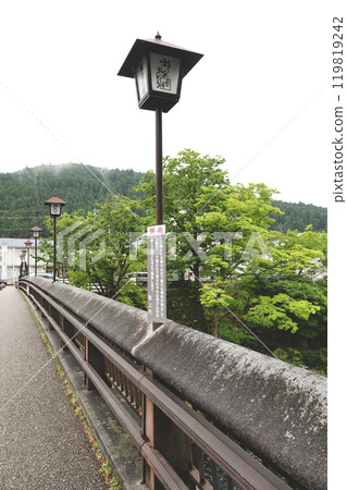 Lantern-style outdoor lighting installed on the railing of Gujo Hachiman Shinbashi Bridge 119819242