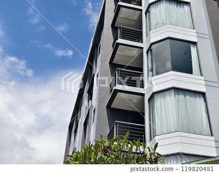Detailed view of windows, doors and balconies of city buildings  119820481