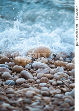 sea wave rolling on the rocks 119820648
