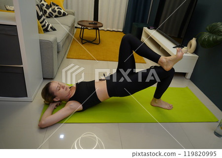 A young woman have a joyfully yoga practice  119820995