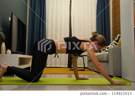 A young woman have a joyfully yoga practice A young woman have a joyfully yoga practice 119821015