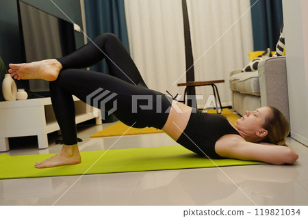 A young woman have a joyfully yoga practice A young woman have a joyfully yoga practice 119821034