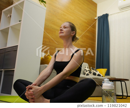 A young woman have a joyfully yoga practice  119821042