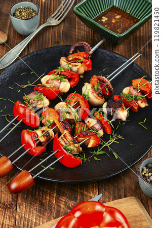 Octopus Skewers with pepper, grilled seafood delicacy. 119821450