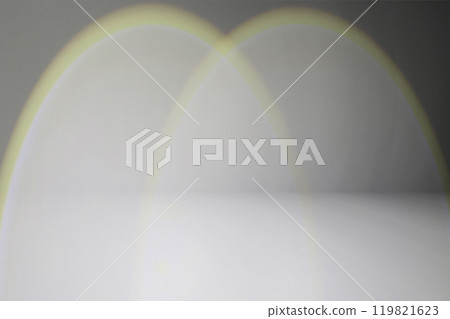 Warm light beam shines on a black wall Warm light beam shines on a black wall 119821623