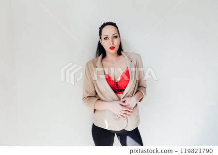 Beautiful plump brunette woman in a business suit 119821790