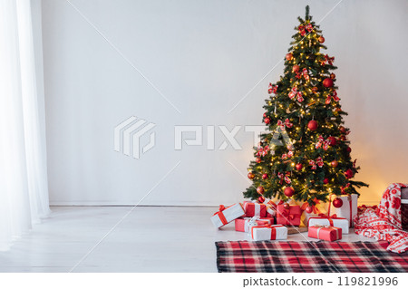 Decorating Christmas Tree with Gifts and Toys Interior New Year 119821996