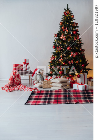 Decorating Christmas Tree with Gifts and Toys Interior New Year Decorating Christmas Tree with Gifts and Toys Interior New Year 119821997