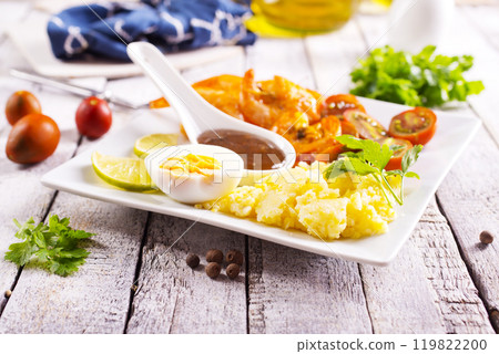 fried seafood (shrimps and squid) with tomato and corn porridge fried seafood (shrimps and squid) with tomato and corn porridge 119822200