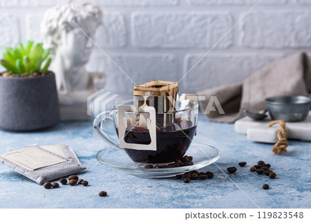 Freshly brewed drip coffee in glass cup 119823548