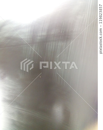 Abstract image with streaked lighting, resembling a blurred reflective surface. Abstract image with streaked lighting, resembling a blurred reflective surface. 119823857