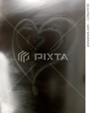 Heart-shaped steam pattern on glass with soft light background, symbolizing love and romance. Heart-shaped steam pattern on glass with soft light background, symbolizing love and romance. 119824356