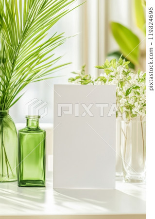 A blank canvas stands on a sunny table indoors during the afternoon 119824696