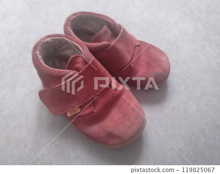 Worn Red Suede Toddler Shoes with Hook-and-Loop Closure Isolated on a White Background 119825067