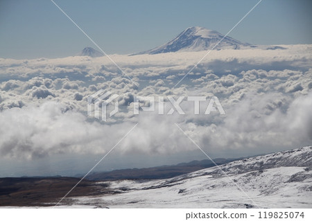Aerial view of the snow-capped Mount Kilimanjaro above the clouds in Tanzania, Africa 119825074