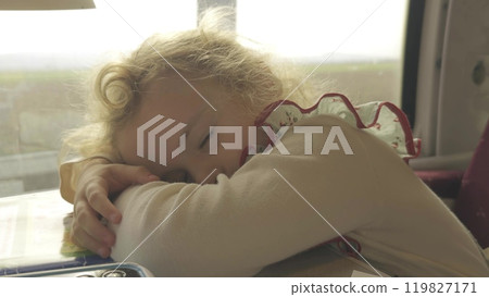 Little girl falls asleep in the French train 119827171