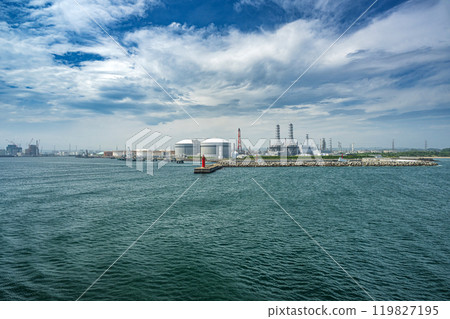 Oil refineries and thermal power plants seen from the sea 119827195