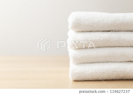 Stacked towels on a table 119827237