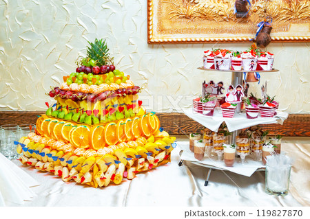 Colorful Fruit Platter With Decorative Presentation at a Festive Gathering Table. Colorful Fruit Platter With Decorative Presentation at a Festive Gathering Table. 119827870