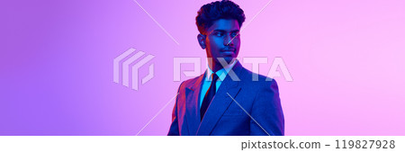 Portrait of young Indian man in formal wear, looking confidently aside, design on pink studio background in neon light 119827928