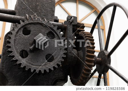 Massive old black gears, close-up photo with selective focus 119828386