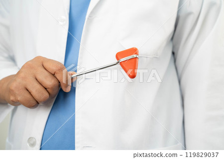 Asian doctor holding court hammer for and crime law justice, forensic medicine. Asian doctor holding court hammer for and crime law justice, forensic medicine. 119829037