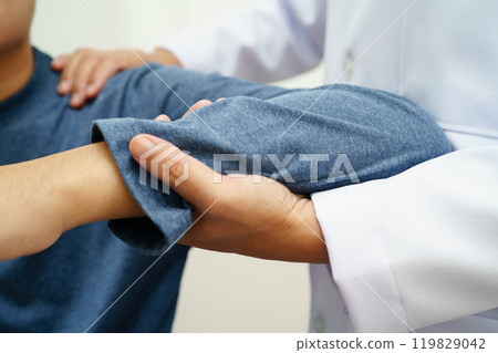 Physical therapy, Asian therapist doctor treat perform pain therapy in hospital. Physical therapy, Asian therapist doctor treat perform pain therapy in hospital. 119829042