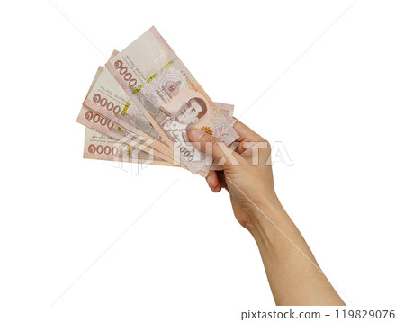 Asian woman holding Thai baht banknote money in hand isolated on white background with clipping path. Asian woman holding Thai baht banknote money in hand isolated on white background with clipping path. 119829076