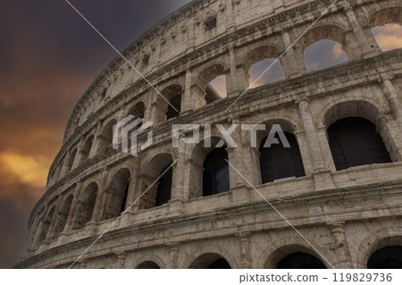 Colosseum amphitheatre under a moody sky in Rome 119829736
