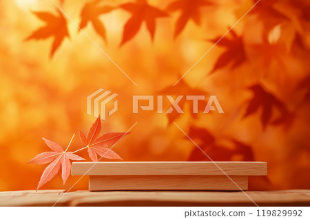 Empty wooden product stand with autumn fallen leaves on orange background. Wood podium for product display, promotion. Fall concept, autumn setting to showcase products, sale 119829992