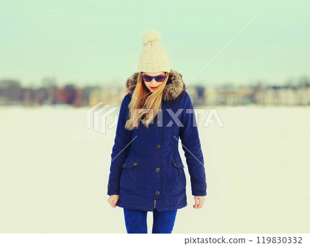 Fashion pretty blonde woman wearing jacket and hat in winter day 119830332