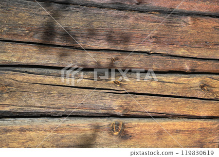 a close-up of a weathered wooden surface, with long horizontal wooden planks 119830619