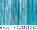 Garage door boards stained blue with worn paint. 119831042