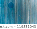Garage door boards stained blue with worn paint. 119831043
